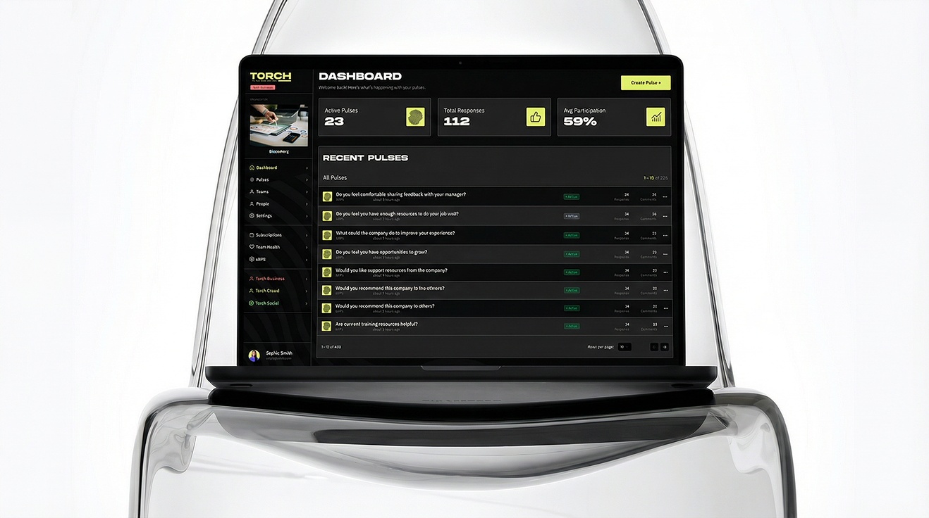 The TORCH dashboard shown on a laptop emerging from a translucent rock-like form, displaying active pulses, total responses, average participation and a list of recent pulses.