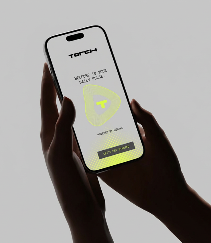 A hand holding a phone showing the TORCH daily pulse welcome screen.